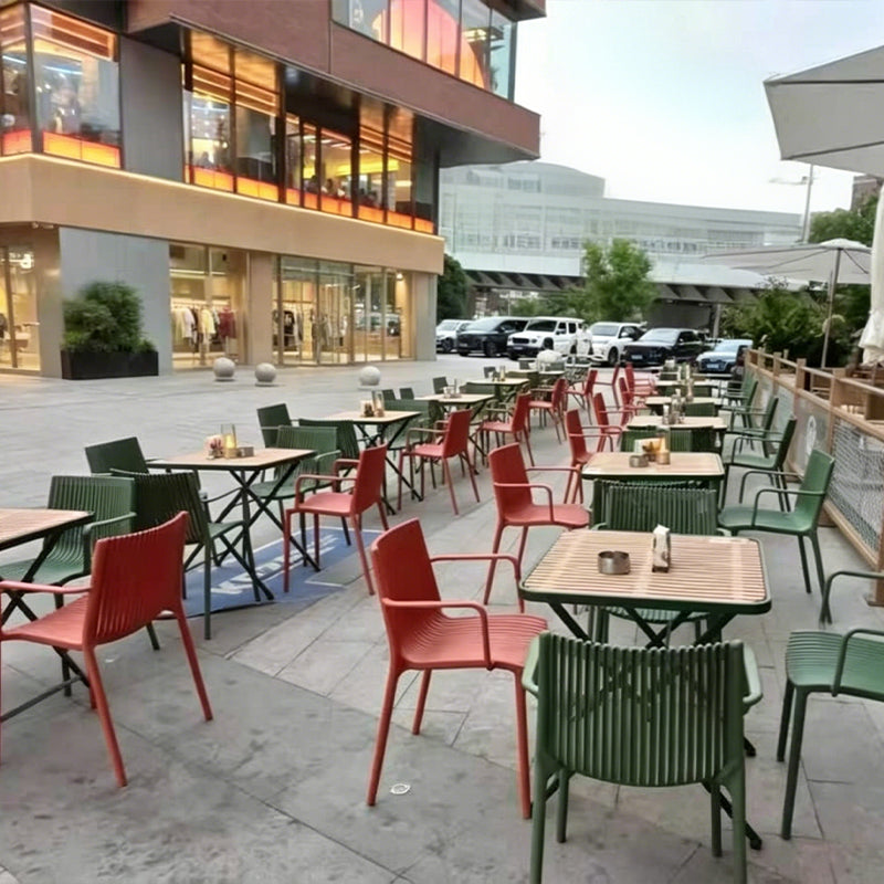 Minimalist modern openwork dining chair, stackable for small apartments, with a backrest.