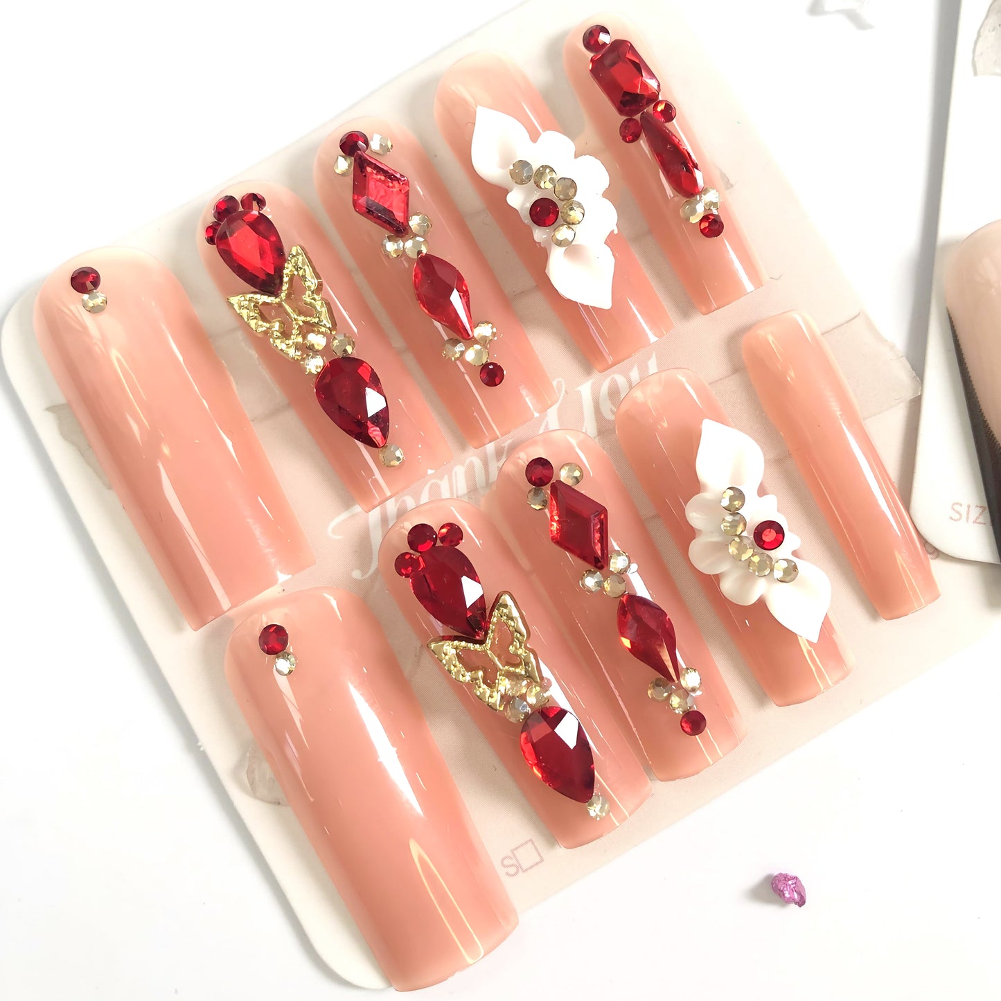 3-piece set, 10 nail tips set of elegant and luxurious wearable press-on nails in nude with stunning black, red and decorative accents