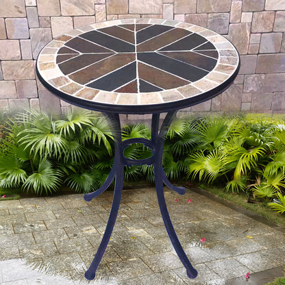 A small round stone table | with a colorful stone - inlaid tabletop and metal legs | an outdoor small round table to start a cozy leisure time.