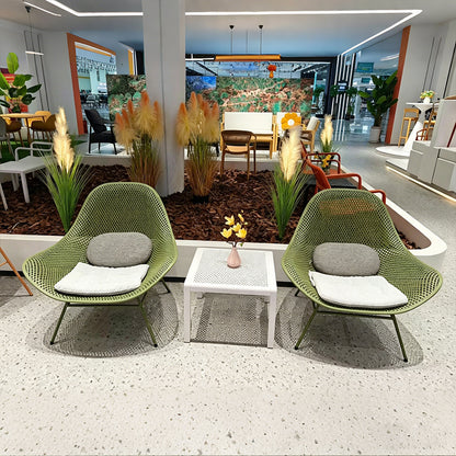 Minimalist modern openwork dining chair, stackable for small apartments, with a backrest.