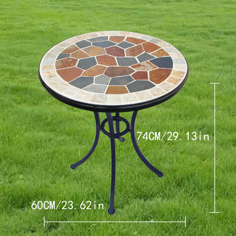 A small round stone table | with a colorful stone - inlaid tabletop and metal legs | an outdoor small round table to start a cozy leisure time.