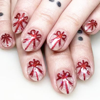 The 2024 new - style Christmas - themed nail art is sweet, featuring a bow