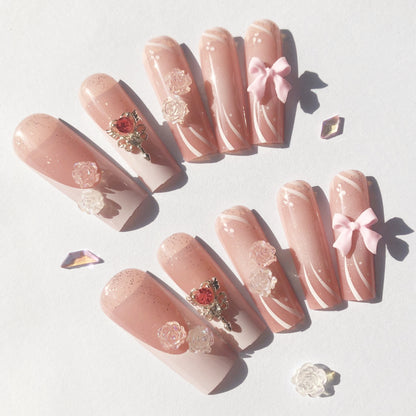 24 nail tips Pink and nude gradient nail art, golden butterflies and white flowers embellish delicate fingertips