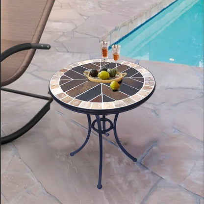 A small round stone table | with a colorful stone - inlaid tabletop and metal legs | an outdoor small round table to start a cozy leisure time.