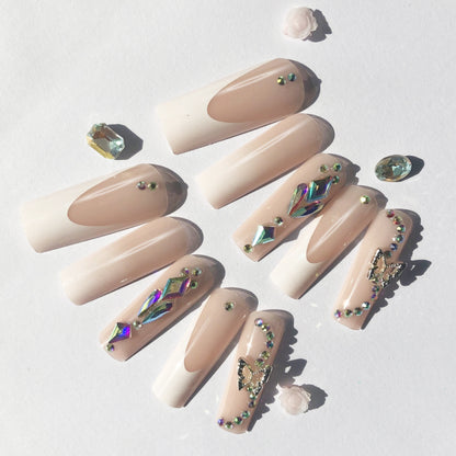 24 nail tips Pink and nude gradient nail art, golden butterflies and white flowers embellish delicate fingertips
