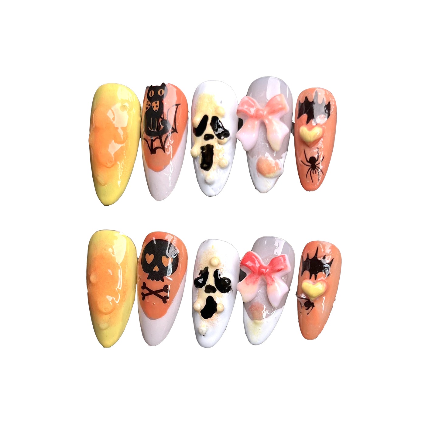 Halloween-themed nail art with skull, bat, and bow elements