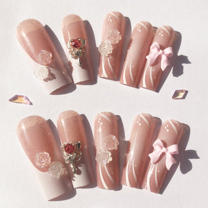 24 nail tips Pink and nude gradient nail art, golden butterflies and white flowers embellish delicate fingertips