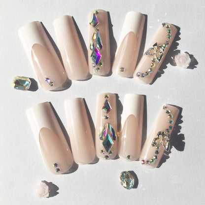 24 nail tips Pink and nude gradient nail art, golden butterflies and white flowers embellish delicate fingertips