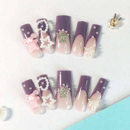 Purple - pink gradient nail stickers, adorned with pearls, stars and bows, encounter a fairy tale on your fingertips.