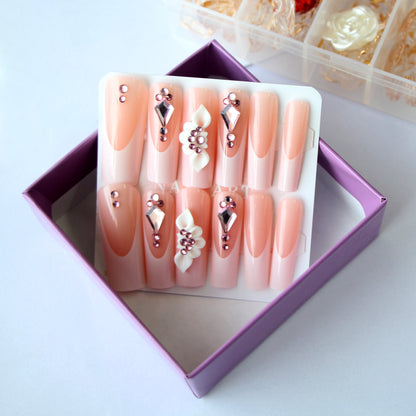 24 nail tips Pink and nude gradient nail art, golden butterflies and white flowers embellish delicate fingertips