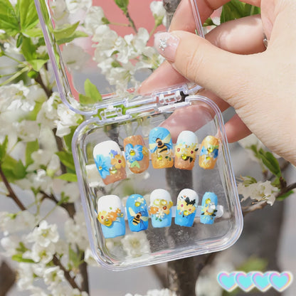 The ambiance is fully enhanced! The nail art products with yellow flowers on a blue base can create a vintage pastoral style.
